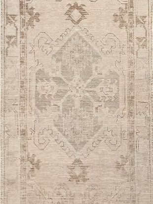 A close up of a rug with a pattern on it.