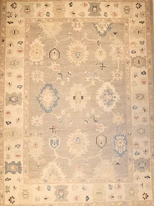 A rug with a floral pattern on it is sitting on a table.