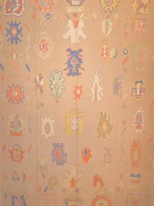 A close up of a rug with a pattern on it.