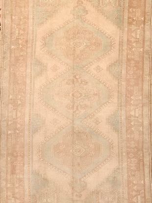 A close up of a rug with a pattern on it.