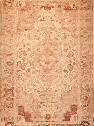 A close up of a rug with a floral pattern on it.