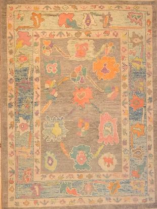 A rug with a floral pattern on it is sitting on a table.