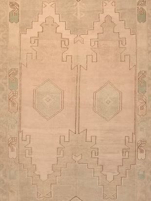 A close up of a rug with a geometric pattern on it.