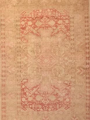 A close up of a rug with a pattern on it.