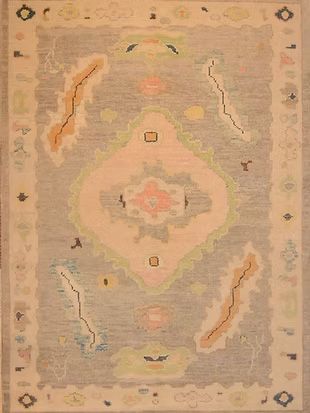 A rug with a pattern on it is sitting on a table.