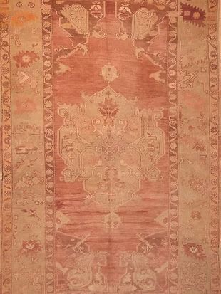 A close up of a rug with a floral pattern on it.