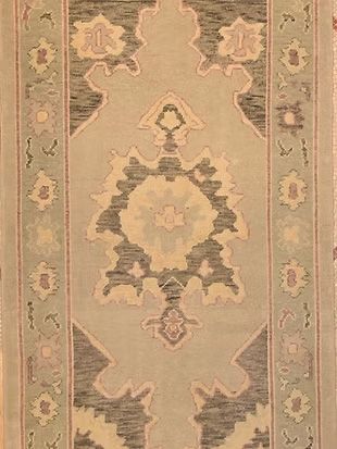 A close up of a rug with a floral pattern on it.