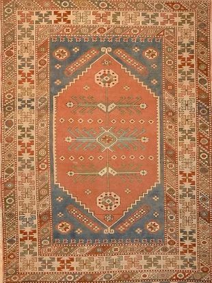 A rug with a pattern on it is sitting on a table.