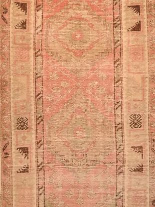 A close up of a rug with a pattern on it.