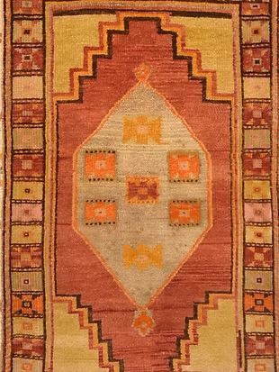 A close up of a rug with a geometric pattern on it