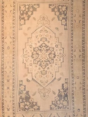 A rug with a pattern on it is sitting on a table.