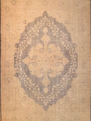 A close up of a rug with a floral pattern on it.