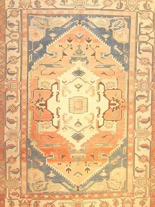 A close up of a rug with a geometric pattern on it