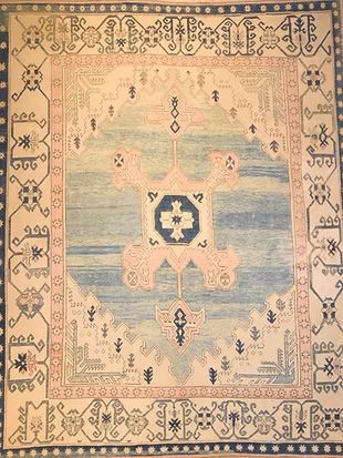 A rug with a blue and white pattern on it