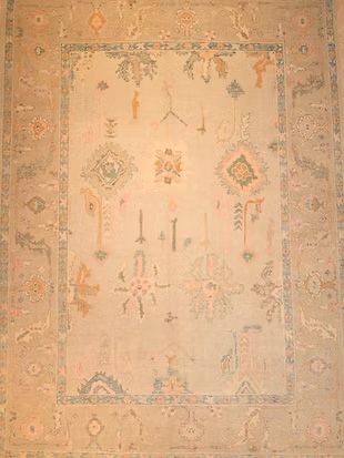 A close up of a rug with a floral pattern on it.