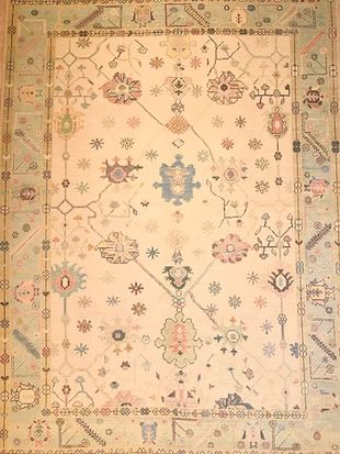 A close up of a rug with a pattern on it.