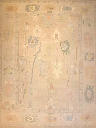 A rug with a floral pattern on it is sitting on a table.