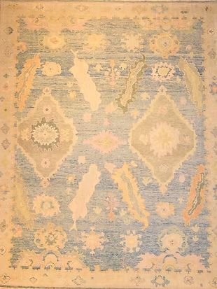 A blue and white rug with a pattern on it is sitting on a table.