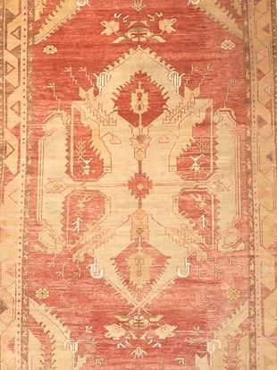 A close up of a rug with a pattern on it.