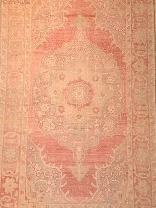 A close up of a rug with a pattern on it.