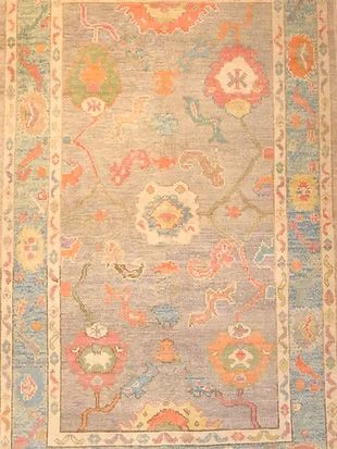 A rug with a floral pattern on it is sitting on a table.