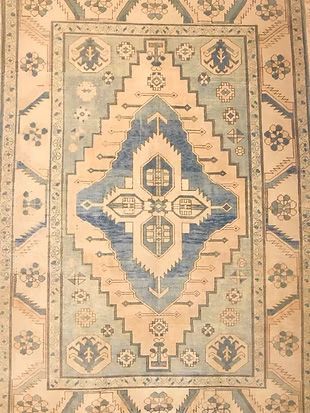 A rug with a blue and white pattern on it