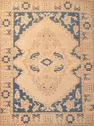A rug with a blue and white pattern on it.