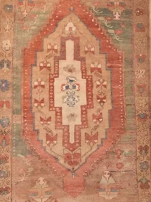 A close up of a rug with a geometric pattern on it.