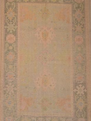 A close up of a rug with a floral pattern on it.