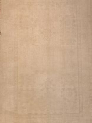 A close up of a beige rug with a square pattern on it.