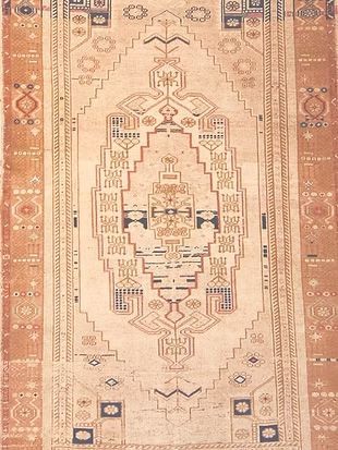 A rug with a pattern on it is sitting on a table.