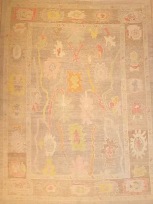 A rug with a floral pattern on it is sitting on a table.