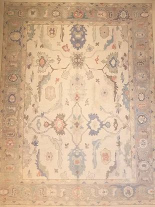 A rug with a floral pattern on it is sitting on a table.