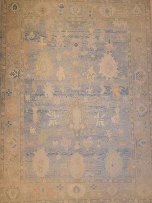 A close up of a rug with a floral pattern on it.