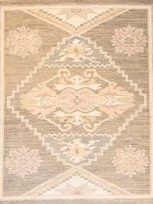 A close up of a rug with a geometric pattern on it.