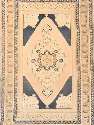 A rug with a blue and white pattern on it