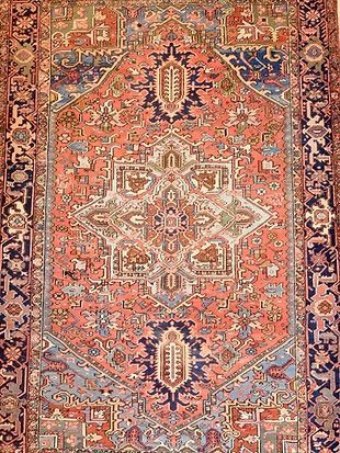 A close up of a rug with a pattern on it.