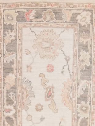 A close up of a rug with a floral pattern on it.