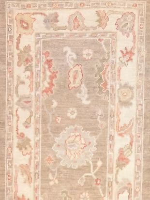 A close up of a rug with a floral pattern on it.