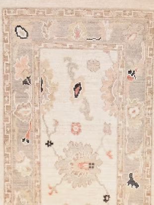 A close up of a rug with a floral pattern on it.