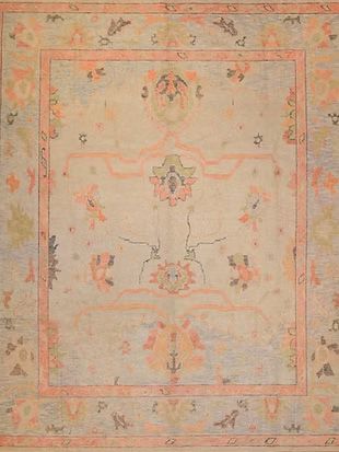 A close up of a rug with a floral pattern on it.