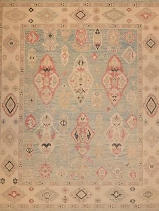 A close up of a rug with a geometric pattern on it.