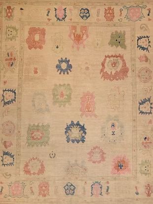 A close up of a rug with a floral pattern on it.