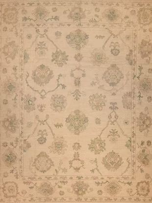 A close up of a rug with a floral pattern on it.