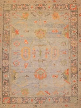 A close up of a rug with a floral pattern on it.