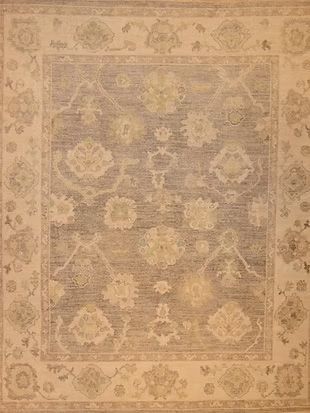 A close up of a rug with a floral pattern on it.