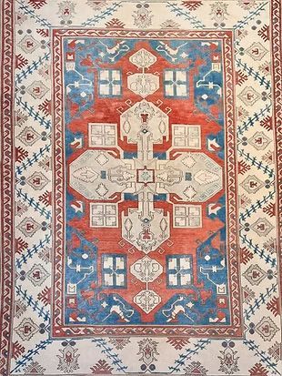 A rug with a red , white and blue pattern on it