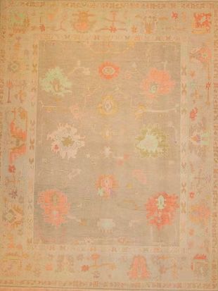 A rug with a floral pattern on it is on a table.