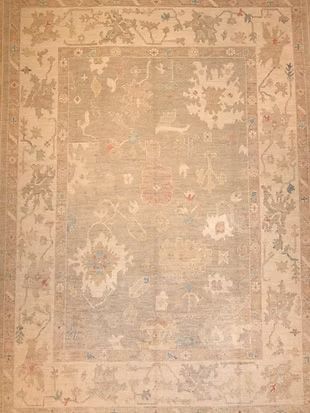 A rug with a floral pattern on it is sitting on a table.
