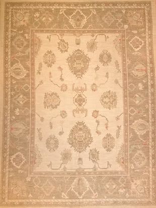 A rug with a floral pattern on it is sitting on a table.